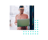 man at standing desk using laptop